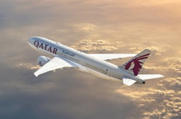 Qatar airplane flying above clouds