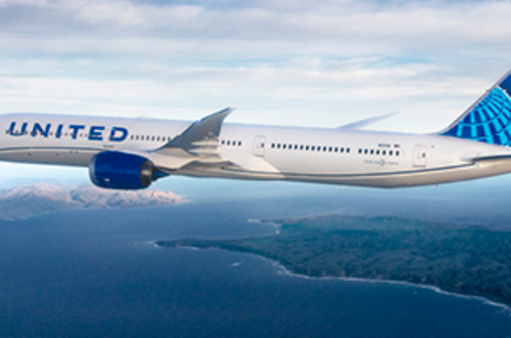 United Airlines plane flying over islands
