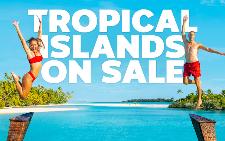 Tropical Islands on Sale. Two people in red swimsuits diving into the ocean