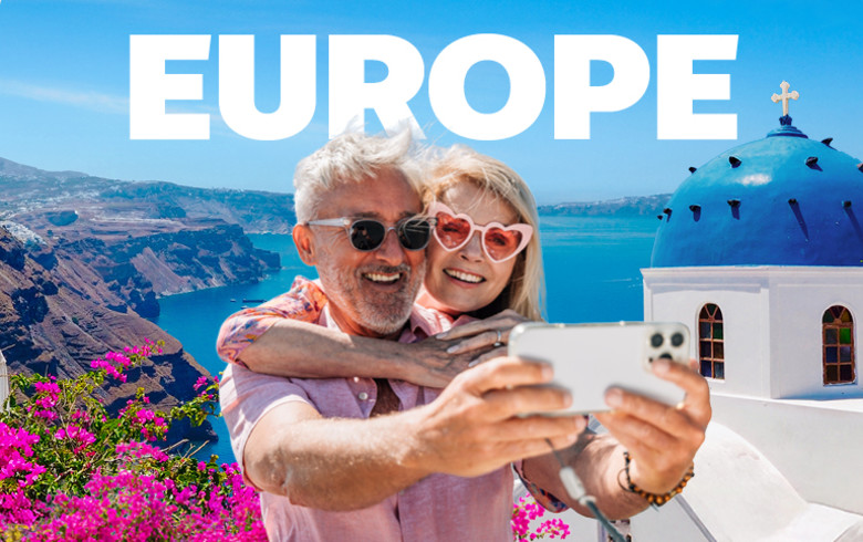 Europe - elderly couple taking a selfie in Santorini