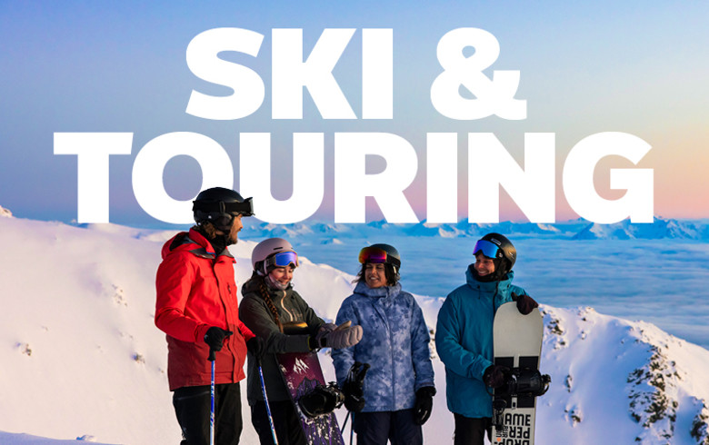 Ski & Touring - friends with snowboards at the top of a mountain