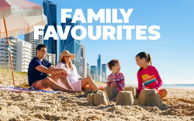 Family favourites - family of four sitting on a Gold Coast beach