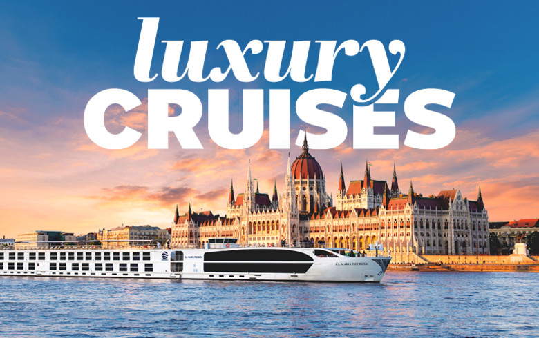 Rriver cruise ship sailing past the Hungarian Parliament Building featuring luxury cruises
