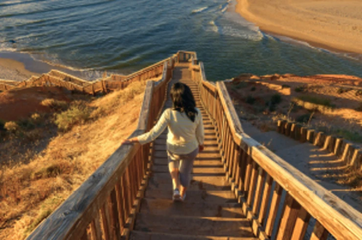 Walking down boardwalk to beach