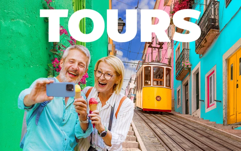 Tours - middle aged couple taking a selfie with ice creams in front of a yellow tram