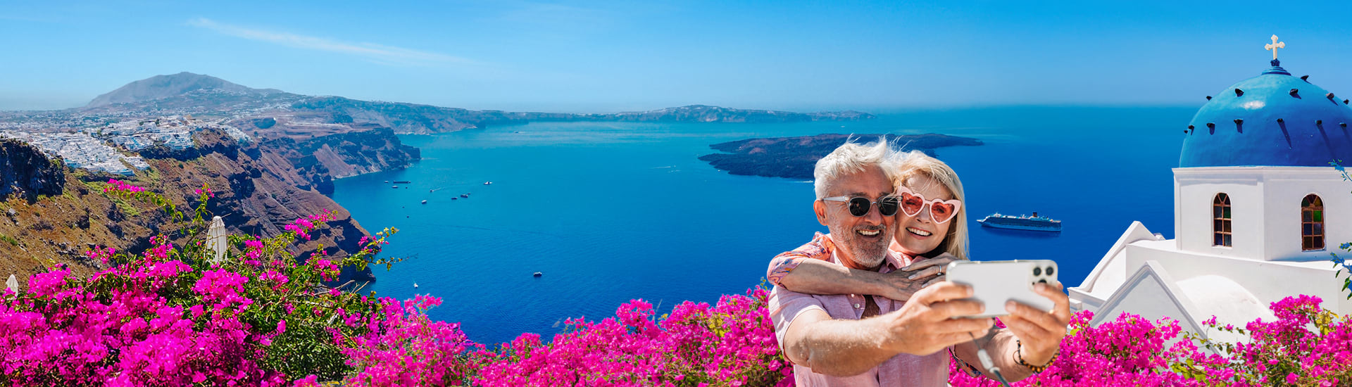 Elderly couple taking a selfie in Santorini