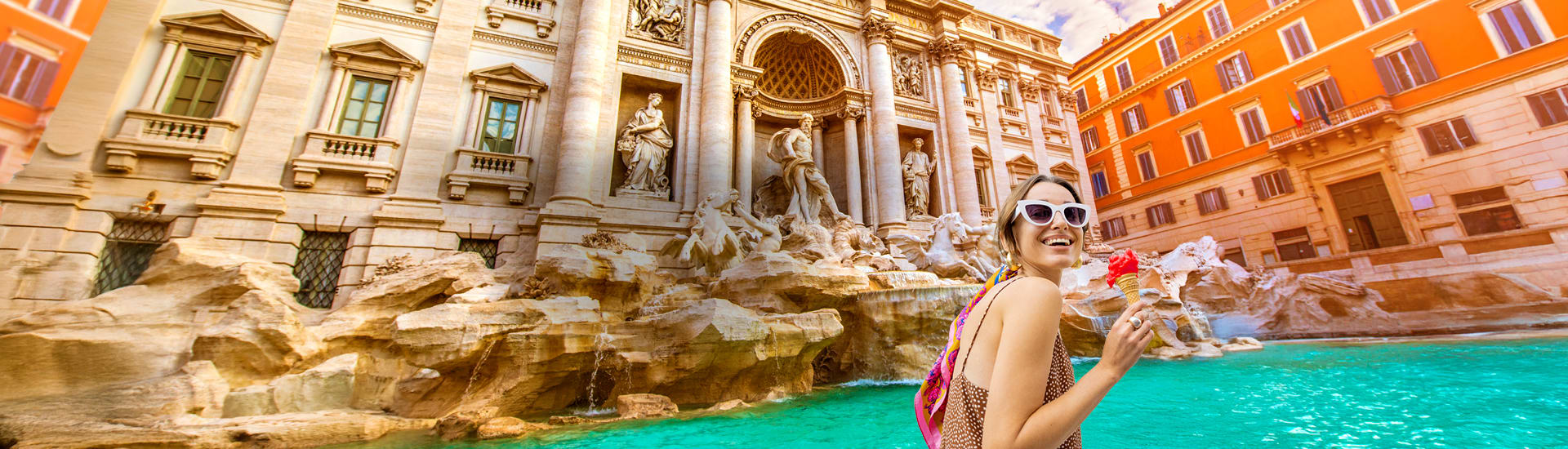 Woman drinking a cocktail at the Trevi Fountain