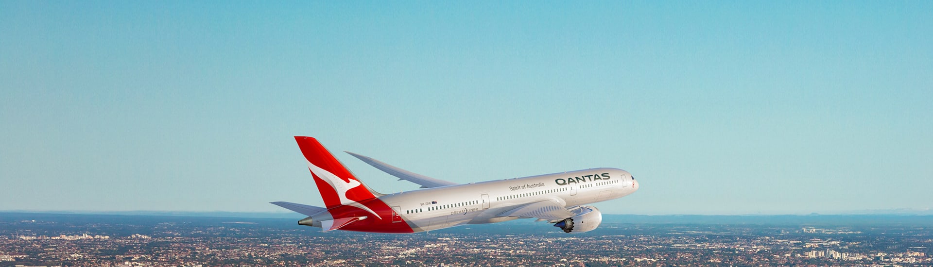 Qantas aircraft climbing over city skyline for double points or status on select flights ending 2 September