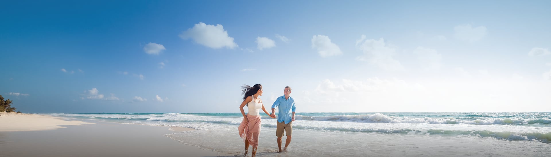A couple walking along the beach
