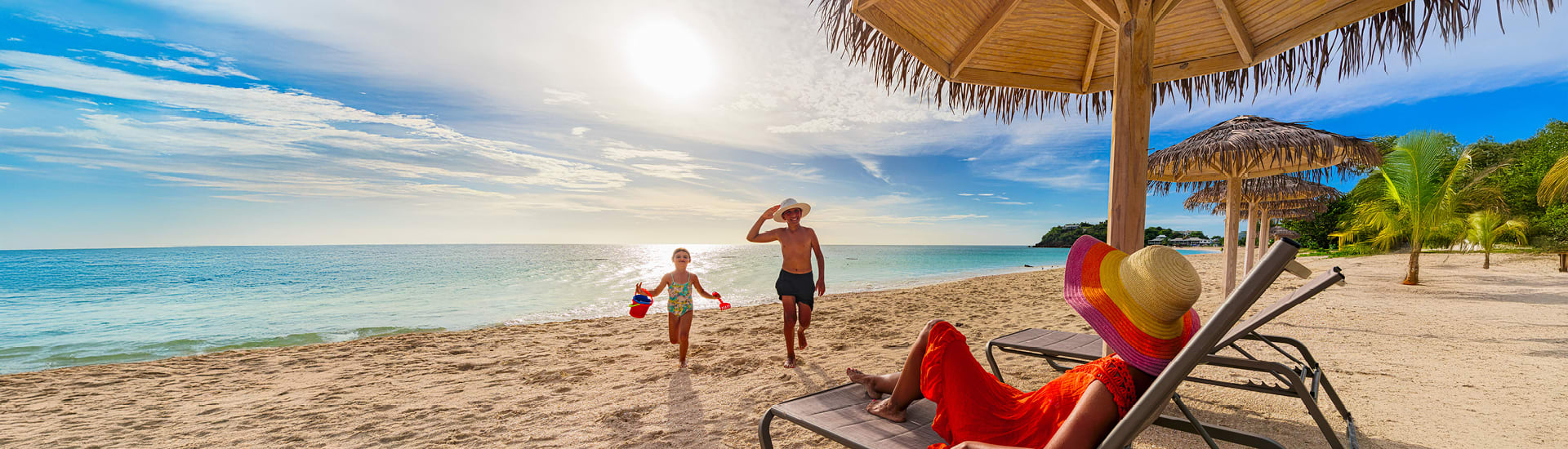 A family with a child on a sunny tropical beach