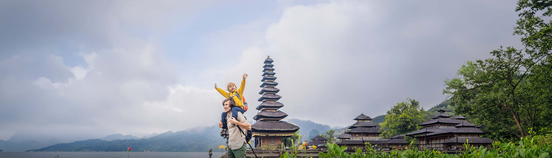 A man and a child exploring temples in Bali