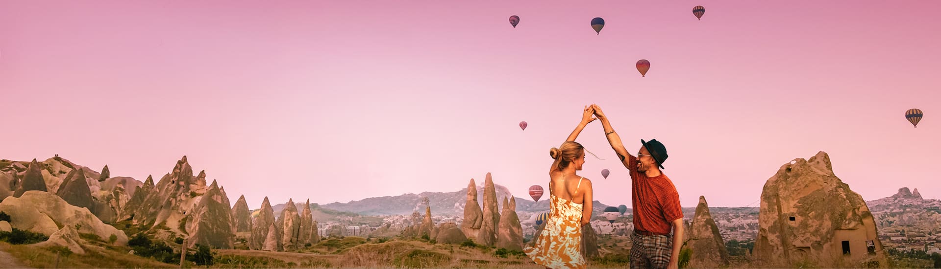 Couple dancing in a field filled with spiky rocks