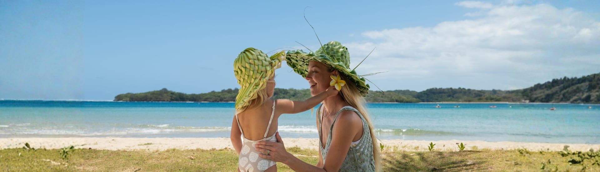 Mother and daughter on a tropical beach