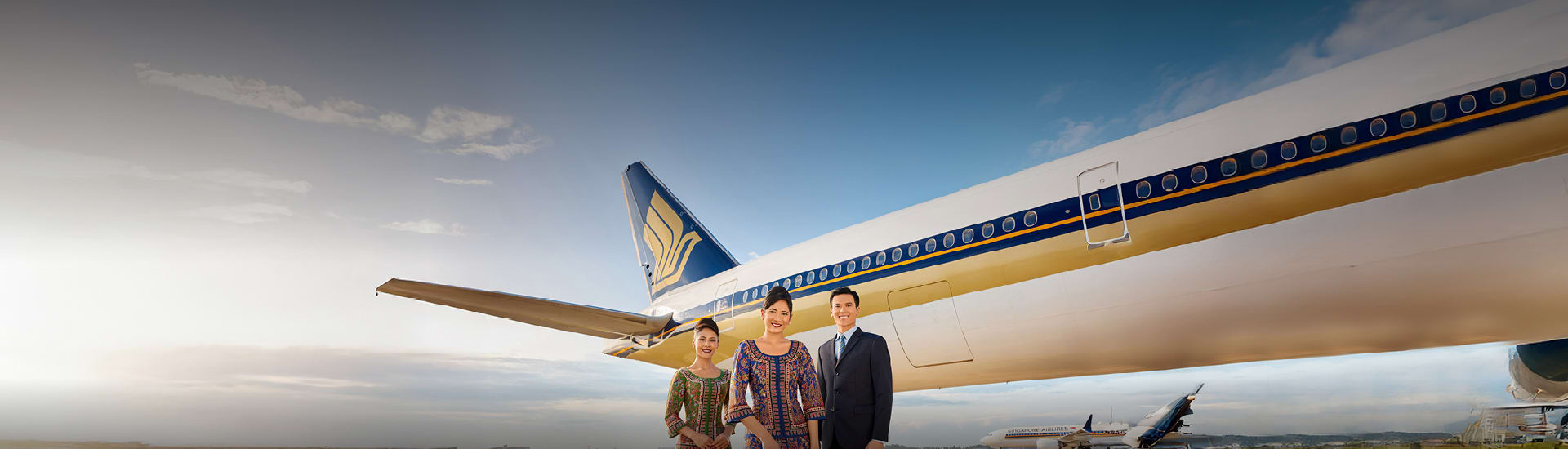 A view of the aircrew in front of a Singapore Airlines plane regarding cheap deals on flights.