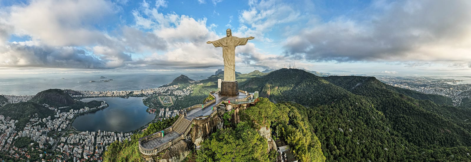 Panorama of Christ the Redeemer and further down is the city of Rio de Janeiro