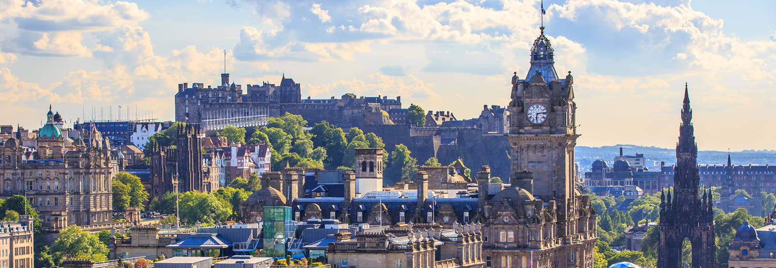 Mountain view of the city of Edinburgh with clock tower as focal point