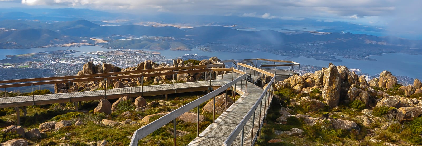 Broad walk on a mountain overlooking ocean views and the town of Hobart