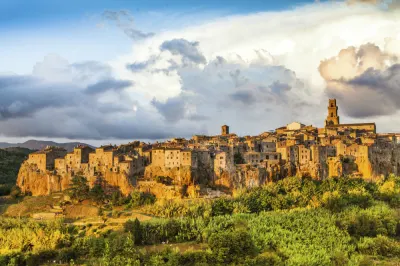 This image: Medieval town of Pitigliano at sunset, Tuscany.