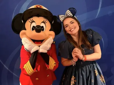 Travel Associates advisor Abby Pezze with Captain Minnie Mouse aboard the Disney Adventure in Singapore.