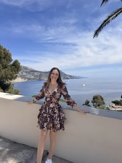 Travel Associates advisor Abby Pezze on a terrace overlooking the Mediterranean on the French Riviera.