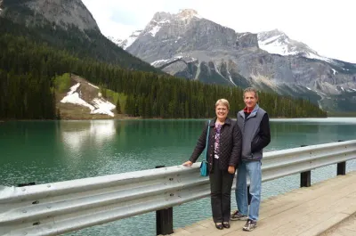 couple infront of lake in the rocky mountains