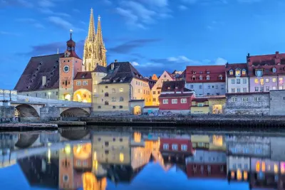 Travel Associates german town on river at nighttime