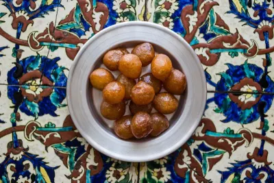 Delicious loukoumades - dense doughnut balls dipped in honey