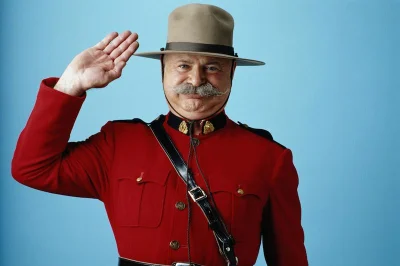 Royal Canadian Mounted Police officer in red ceremonial jacket