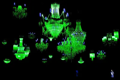 Ken + Julia Yonetani Crystal Palace: The Great Exhibition of the Works of Industry of all Nuclear Nations 2012-13. Uranium glass, metal, UV lighting. Image courtesy of the artists.