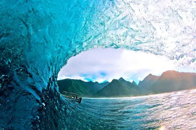 Perfect barrel wave breaks at Teahupoo Beach