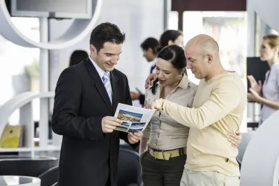 Couple talk to travel agent