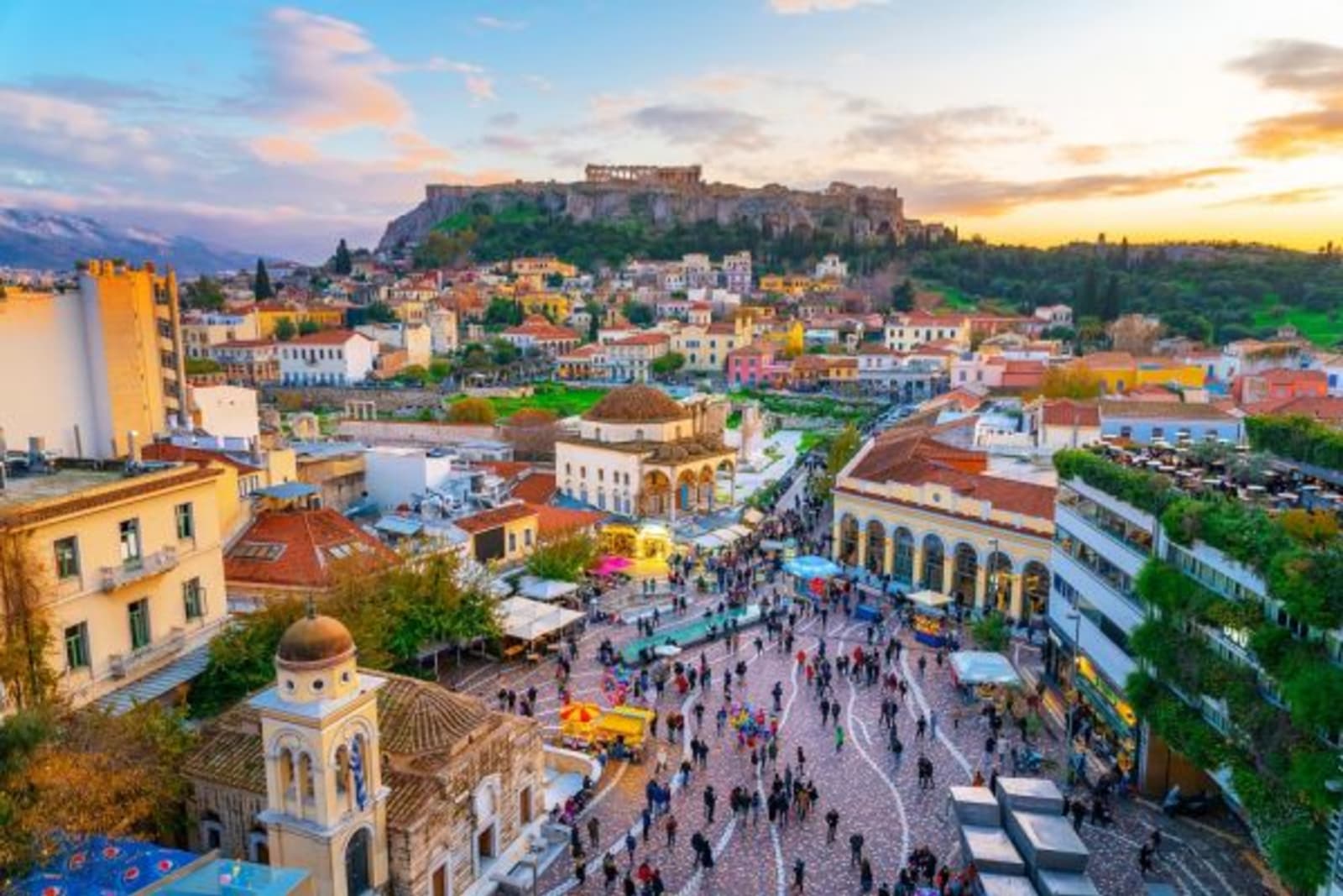 Athens city in sunlight, people walking through street