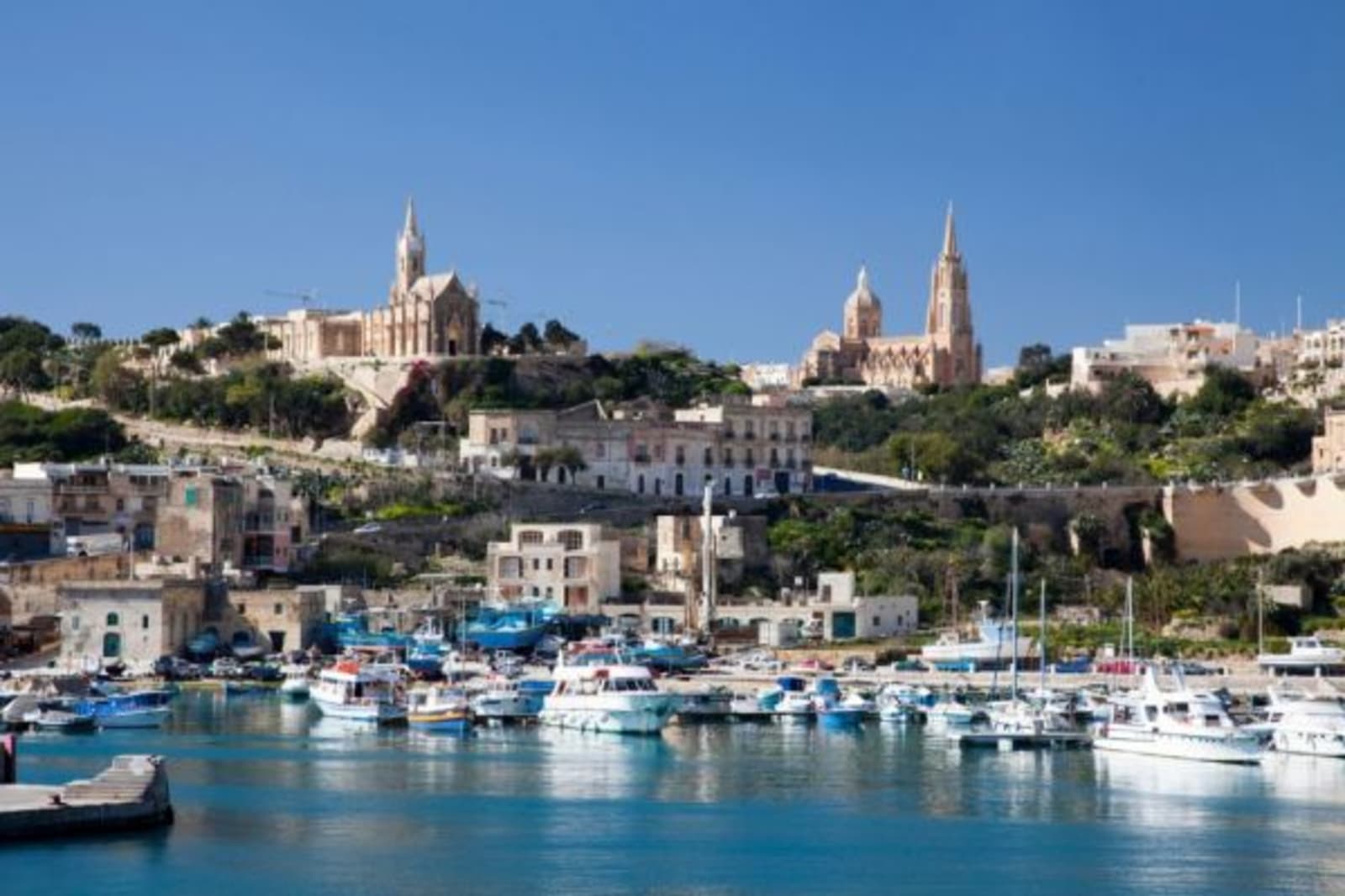 Boat marina in front of town houses in Malta