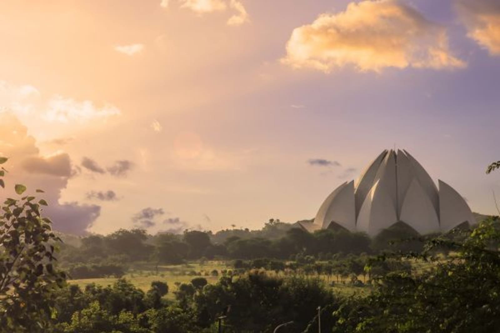 Sun rising next to Lotus Temple in New Delhi