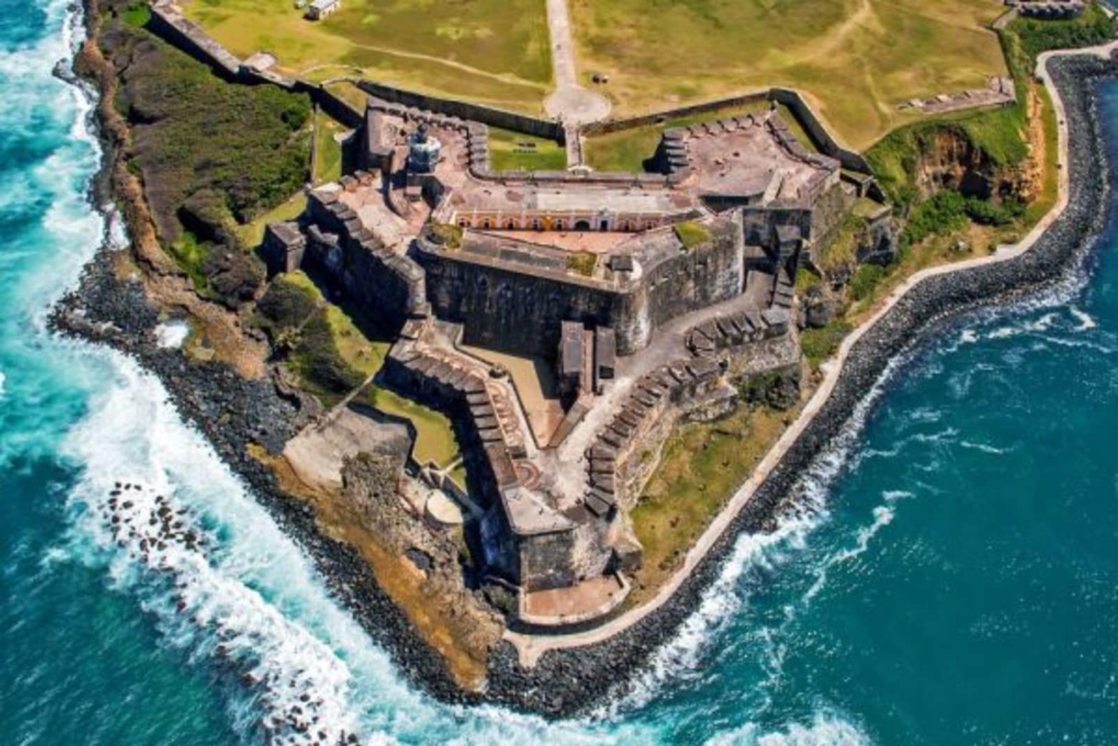 Aerial view of an old fort on the edge of a cliff in Puerto Rico