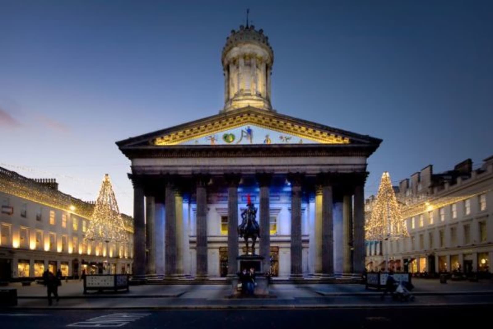 Gallery of Modern Art Glasgow with dim lighting illuminating the exterior features
