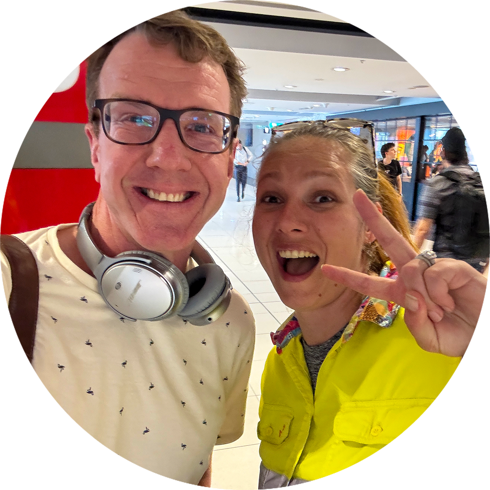 Two people smiling, taking a selfie