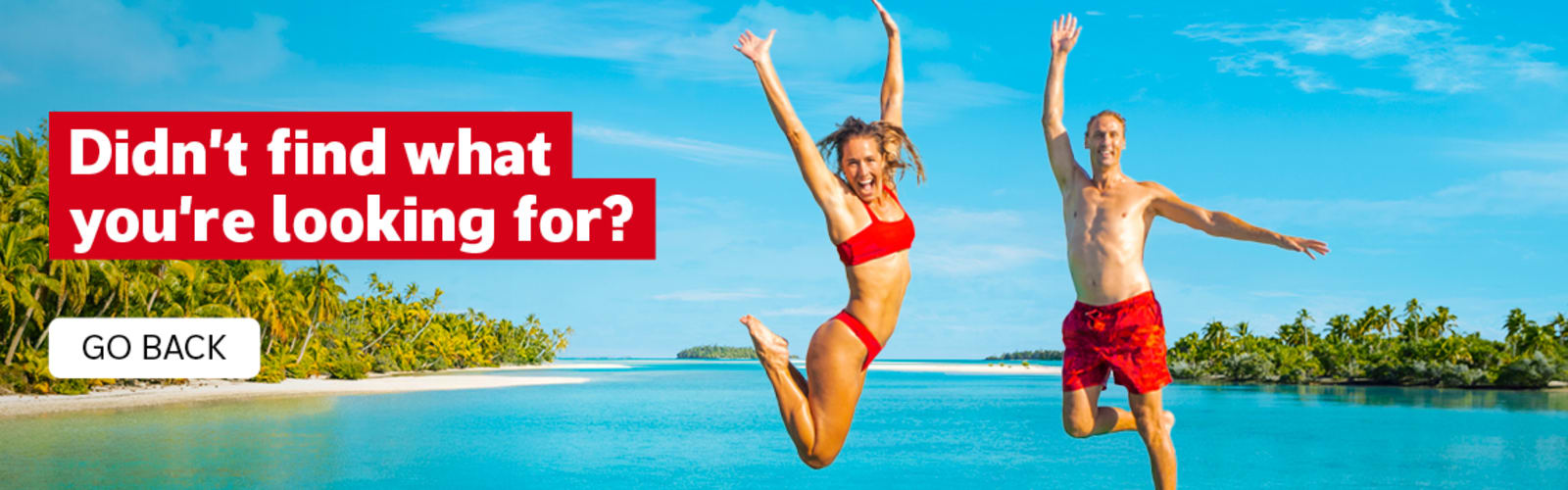 Didn't find what you're looking for? Go Back. Two people in red swimsuits jumping for joy in front of the ocean