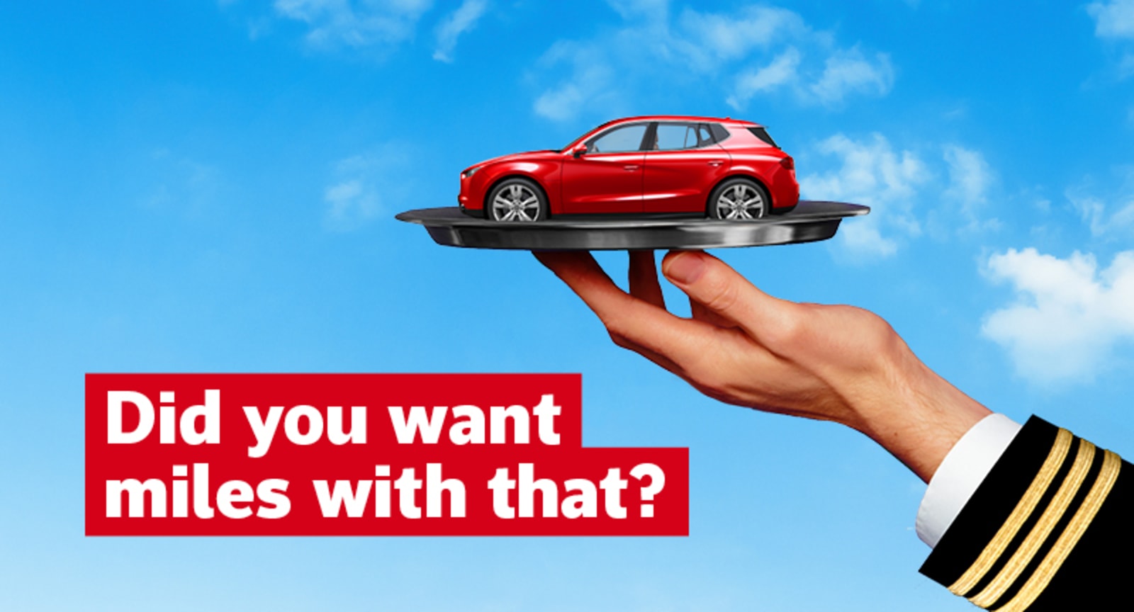Did you want miles with that? | hand holding a plate with a small, red car
