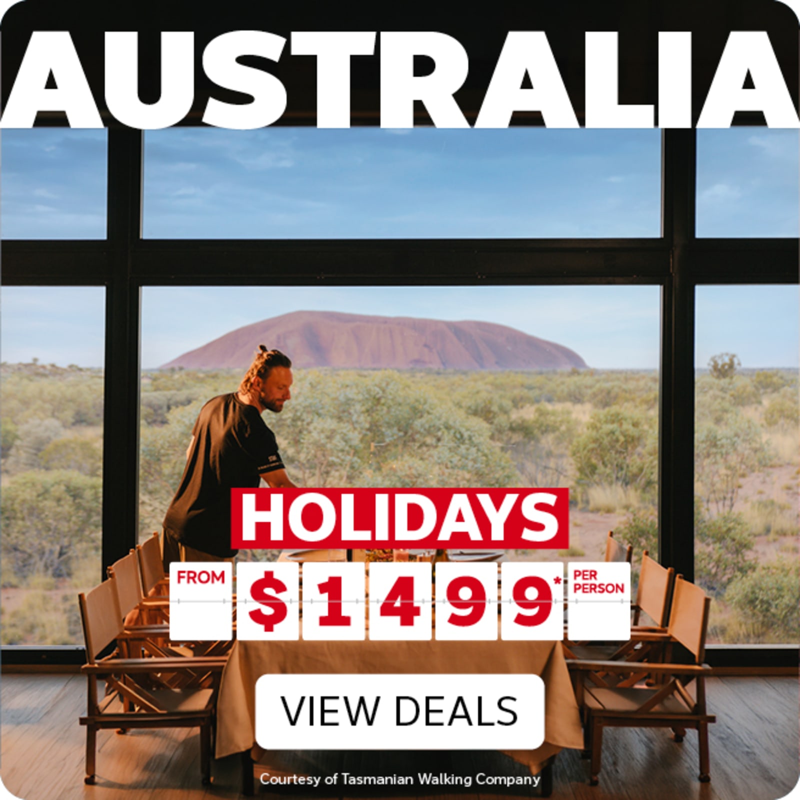 Large window with a view of Uluru featuring Australian holidays from $1499 per person