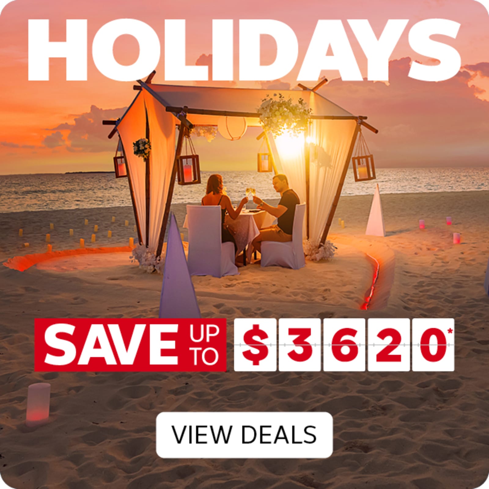 Couple having a candle-lit dinner on a beach at sunset featuring savings up to $3,620 on luxury holidays