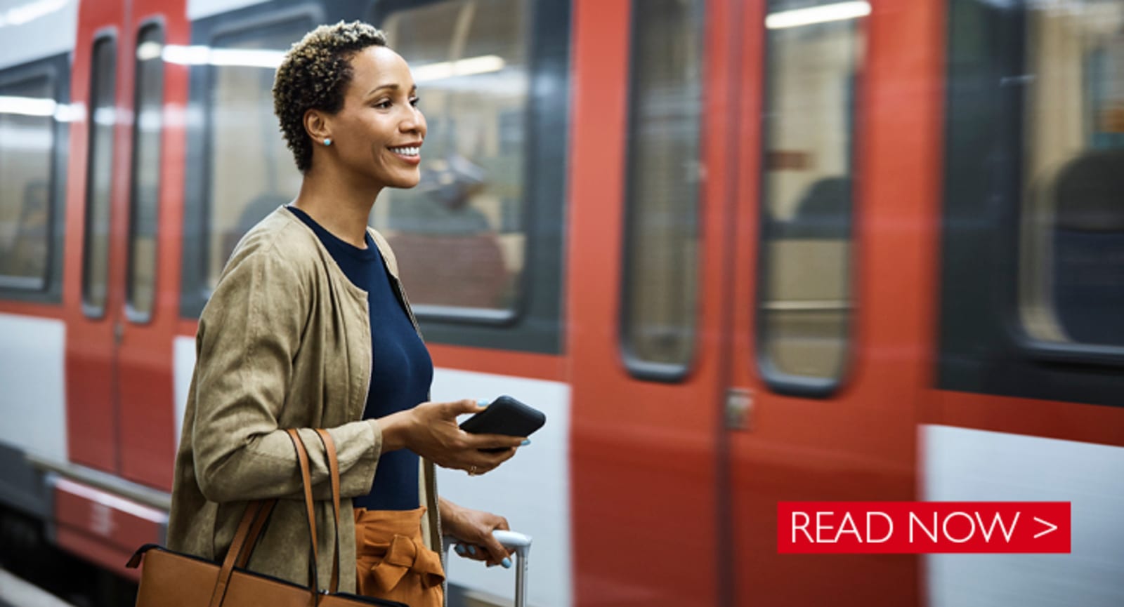 Businesswoman smiling boarding a train - Read Now