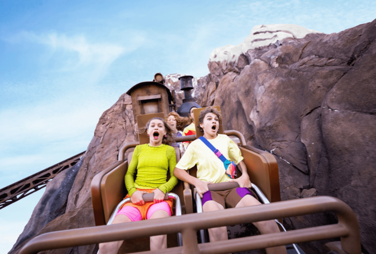 Teens screaming with excitement aboard the Expedition Everest roller coaster at Disney's Animal Kingdom