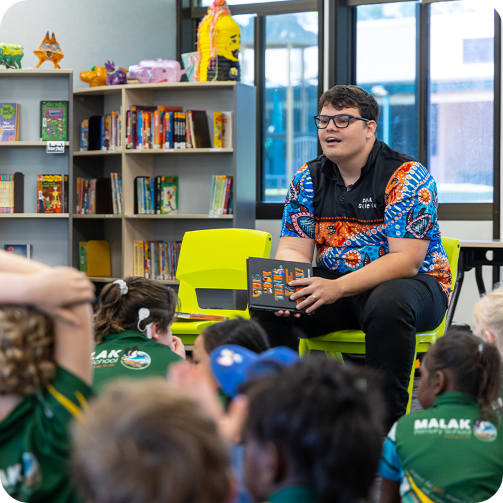 Man reading to schoolchildren about First Nations Australians