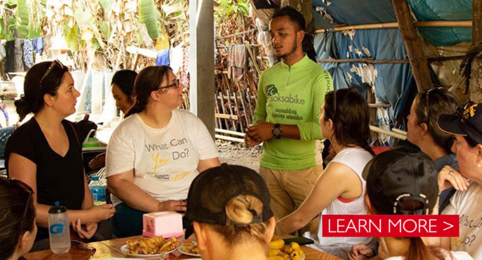 Social workers in a meeting taking place in a bamboo structure