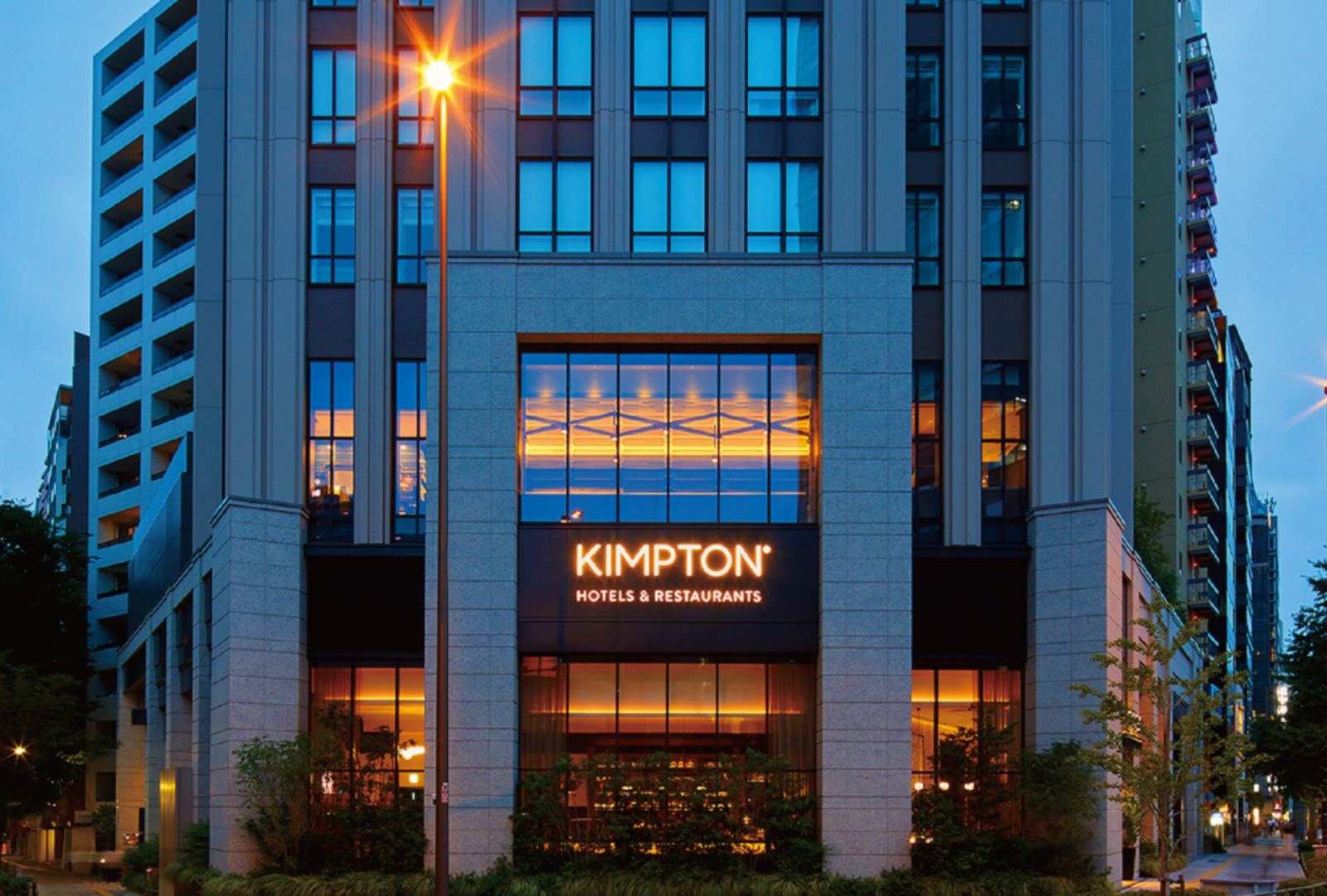 The Kimpton Hotel in Tokyo lit up at dusk