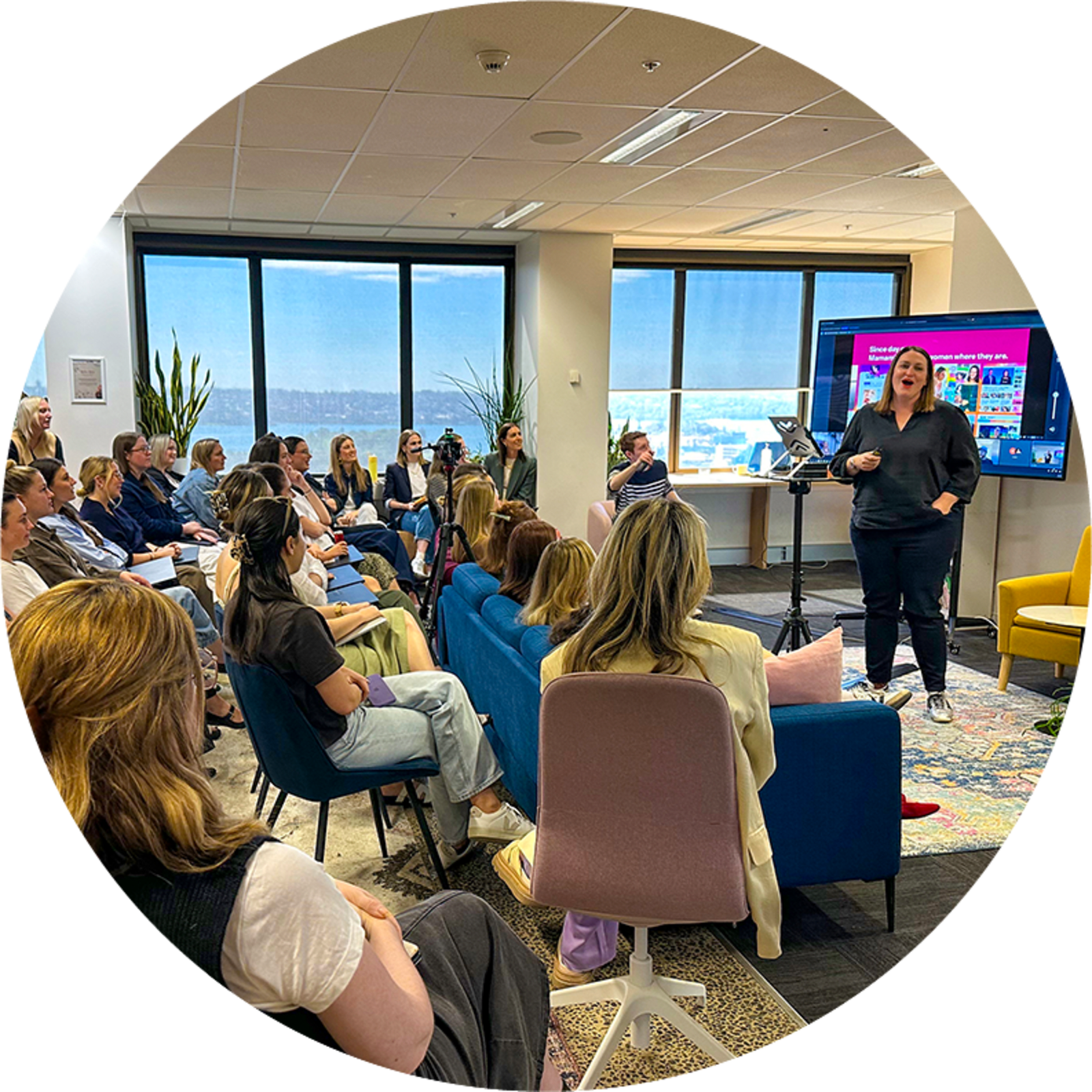 Woman presenting to a room of women