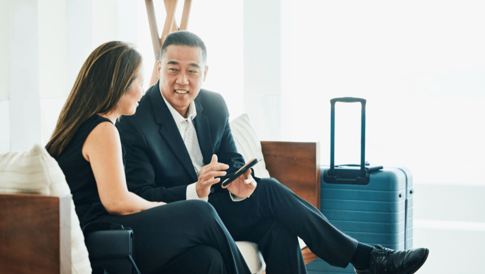 Business travellers on work trip with luggage