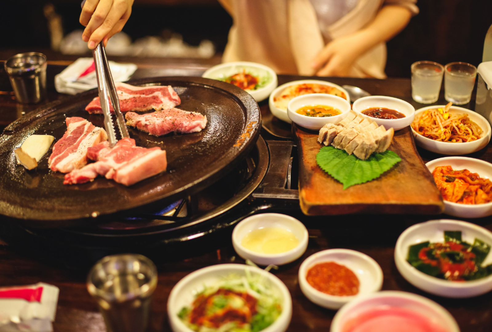 Korea takes BBQ to a new level with sizzling pork belly enjoyed best with aside of kimchi