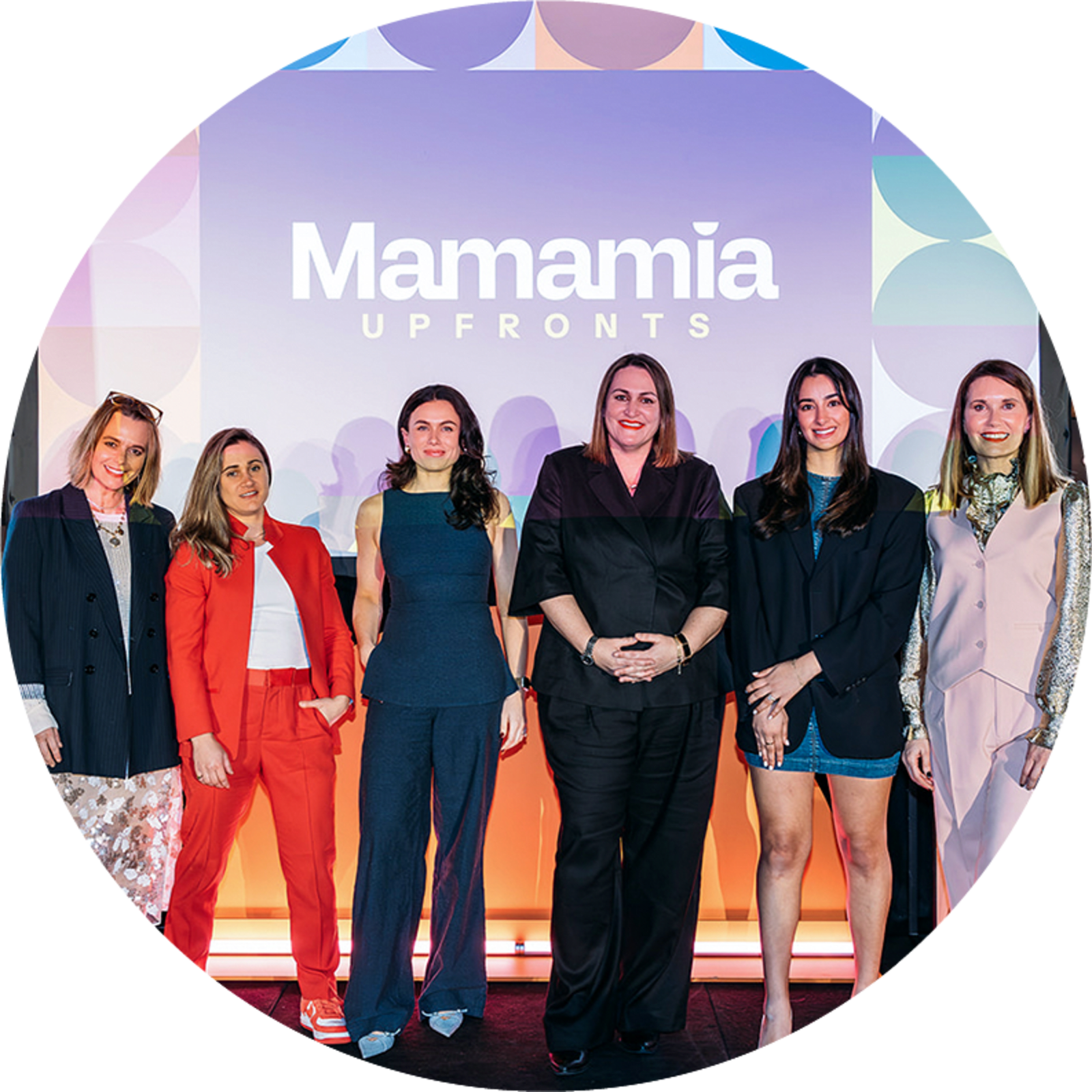 Women of the group 'Mamamia' posing for a professional photo